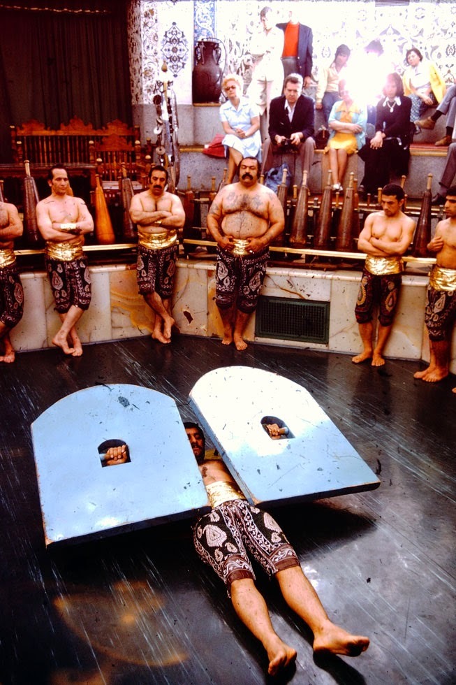 A performance at a zurkhaneh, or House of Strength, where exercises passed down from training to be warriors are performed to the music of bells, drums and the songs of prayer.