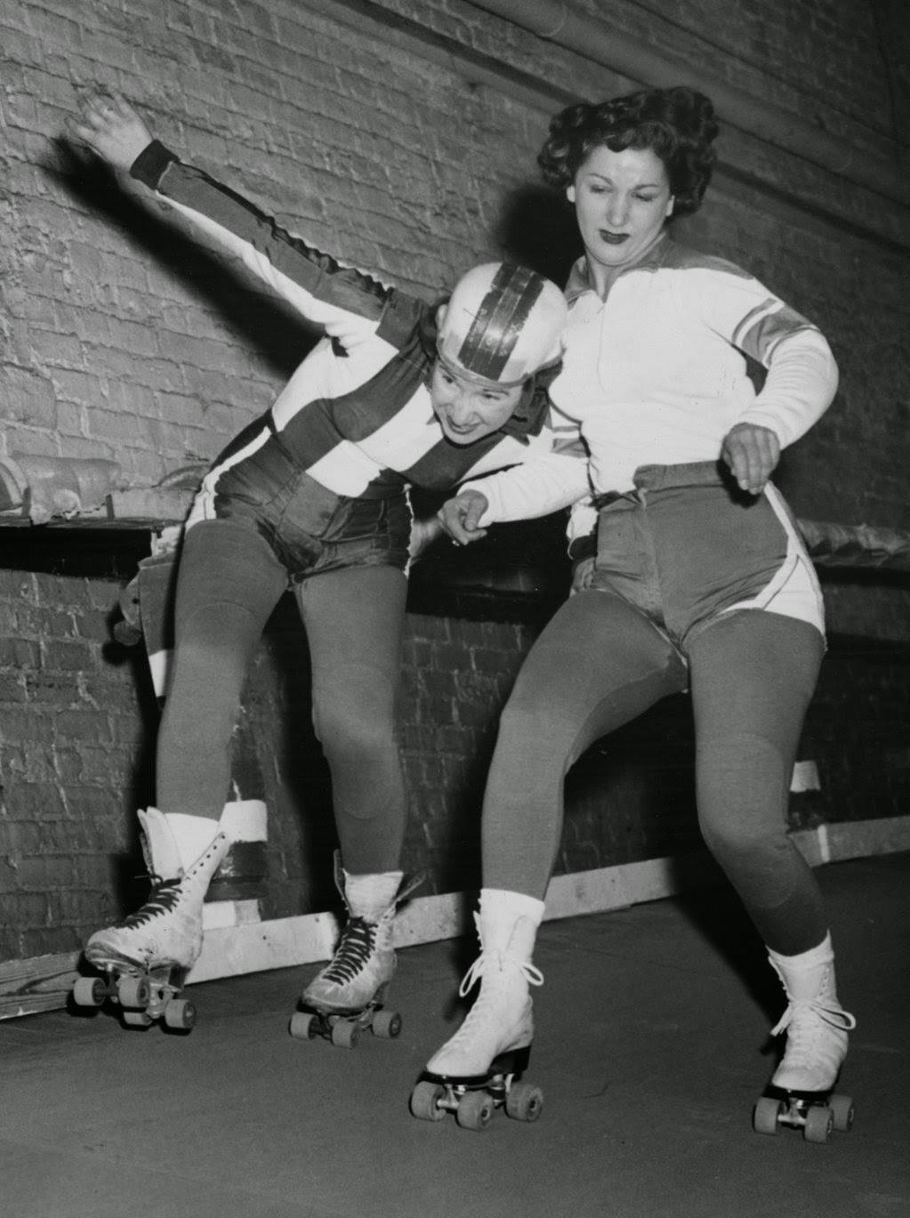 Harriette “Babe” Topel tries to stay on her feet as she gets blocked by Mary Lou Palermo at the Coliseum, 1950s