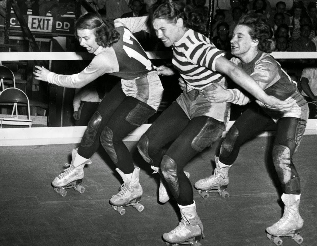 Gerry Murray stays on her feet as Midge “Toughie” Brasuhn tries to take her out while Vera Minenko tries to stay upright, 1940s