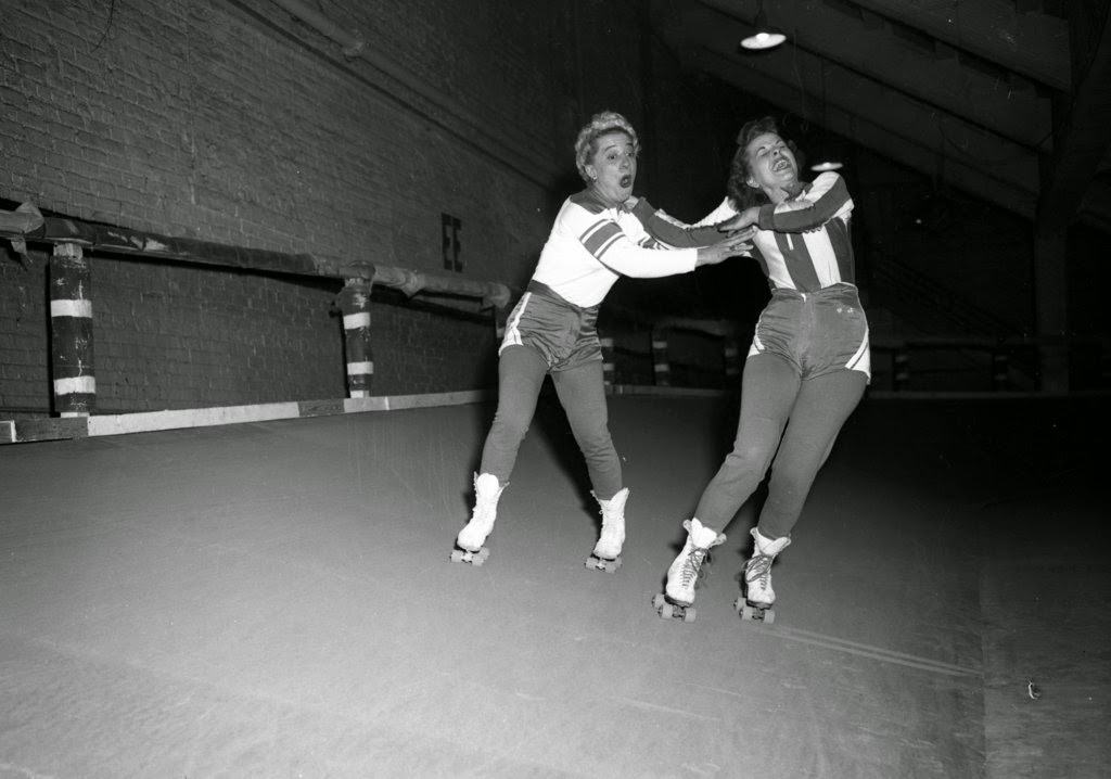 Toughie Brasuhn and Betty Clements at a roller derby at the Coliseum, 1950s