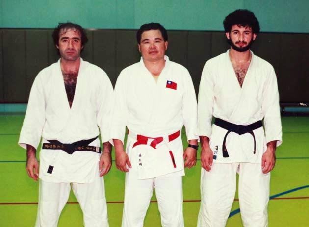 Taiwanese coach Jimmy Wu (C) seen with who he says is himself with Osama Bin Laden (R) and an unidentified man dressed in their judo gi in Riyadh